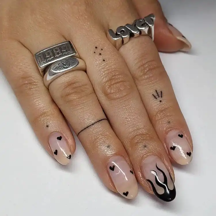 Goth and Emo Nail Designs with Nail Chart 5 Gray and black nails featuring a modern gray base with contrasting black splatters or abstract elements