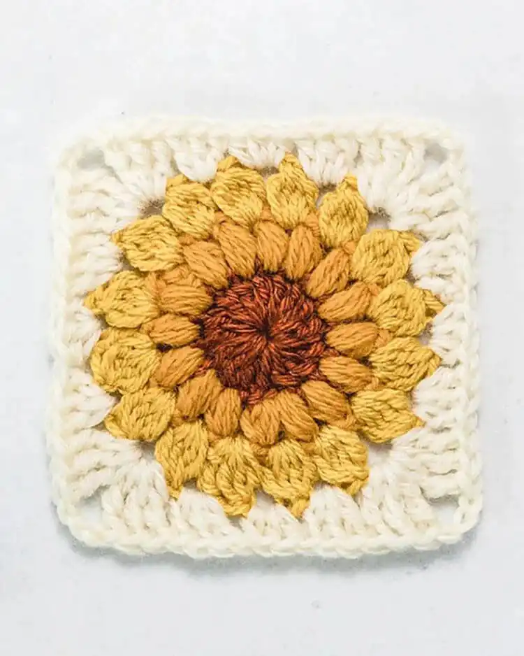 Vibrant Sunflower Granny Square motif with bright yellow petals and a brown center