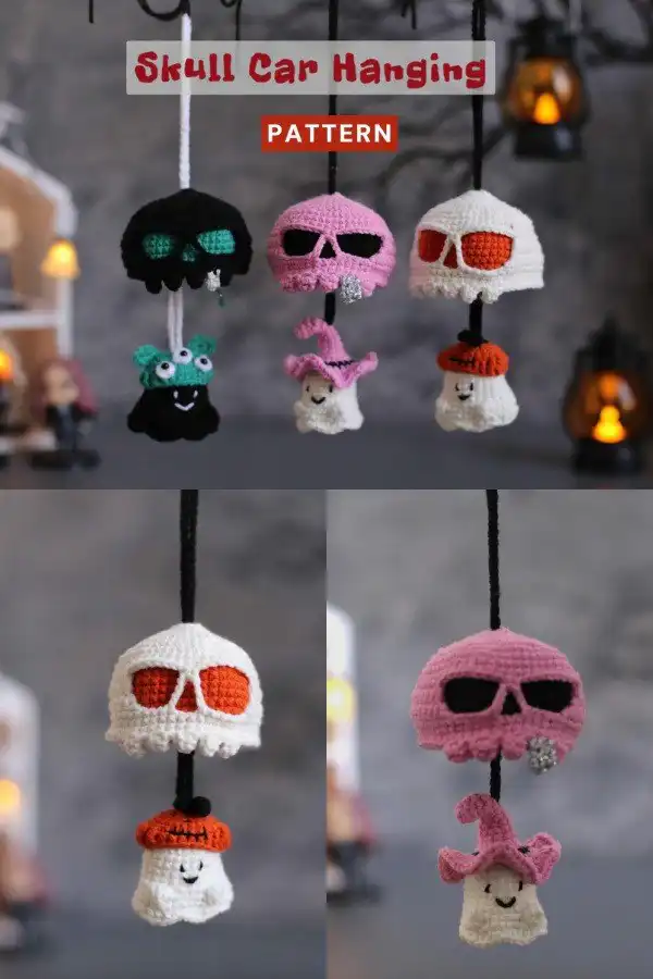 An intricate crochet skull car charm, crafted in white yarn with detailed eye sockets and nasal cavity, designed to hang from a rearview mirror.