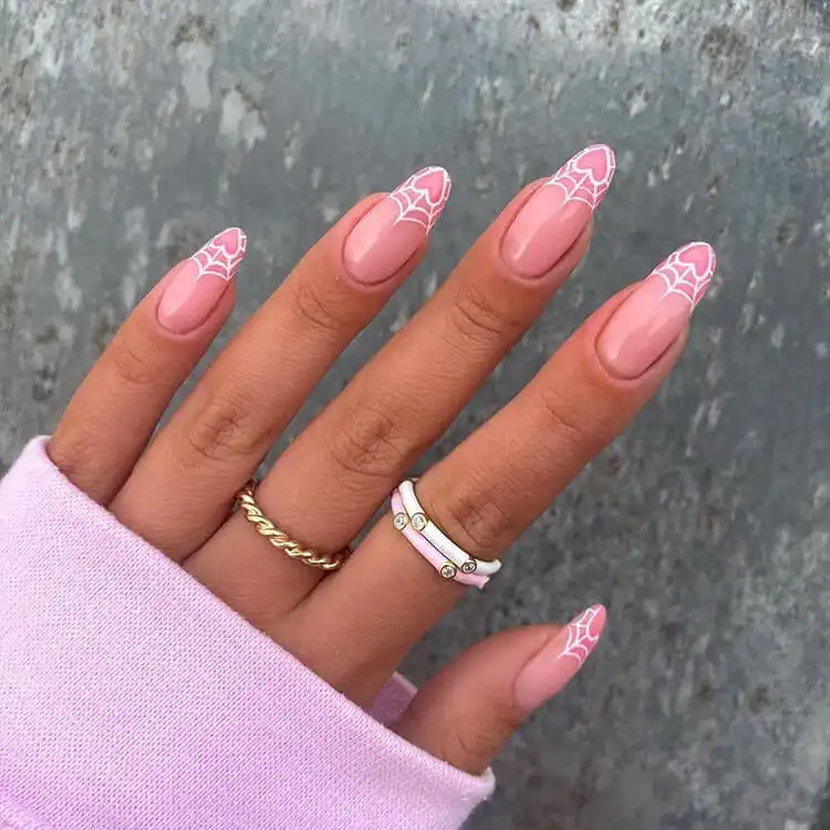Heart-Shaped Spider Web Nails in pink and white, a unique and festive design for Valentine's Day with a gothic twist.