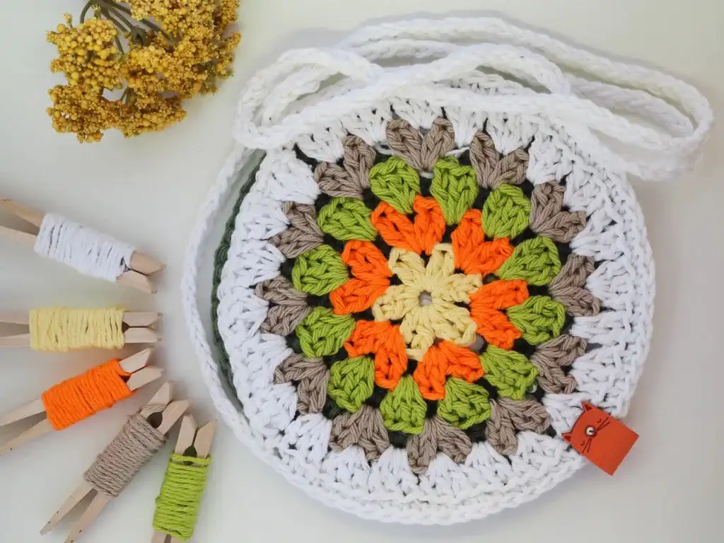 A vibrant granny circle bag in summer colors, showcasing a practical application of crocheted circles as a finished project.