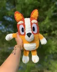 How to Crochet Bingo from Bluey Cute Amigurumi Pattern 1 Collection of various crocheted Bluey and Bingo amigurumi toys in different styles and sizes.