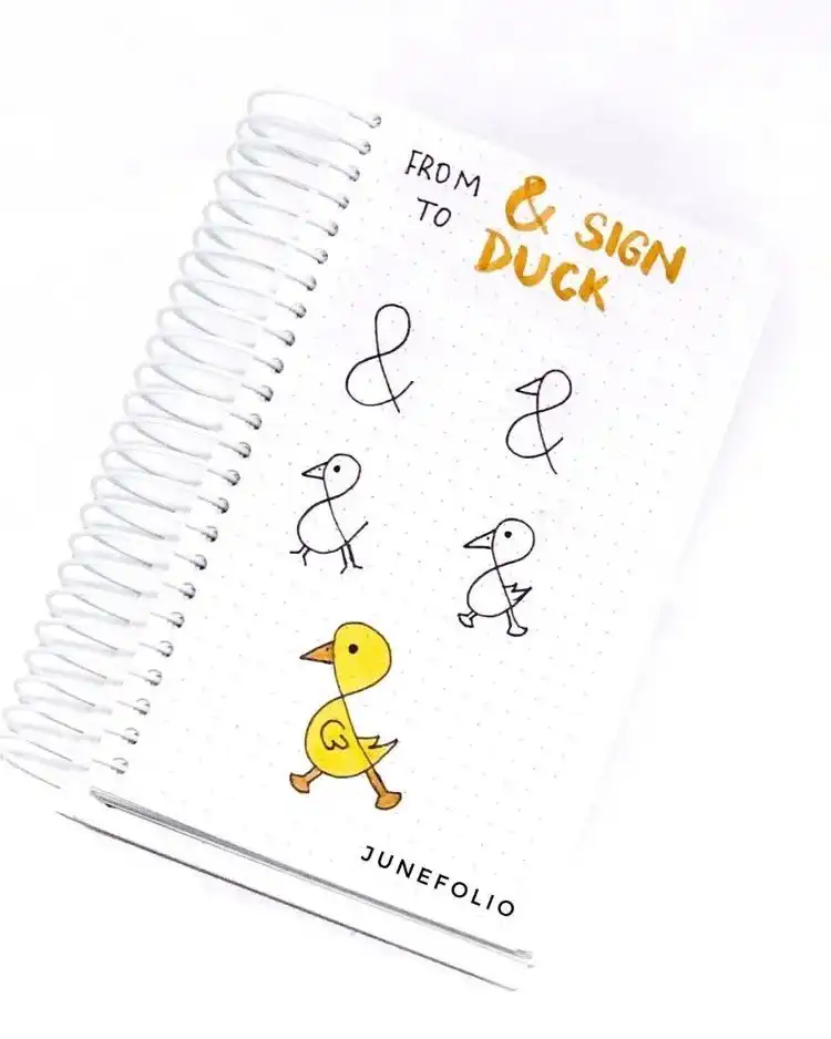A creative tutorial transforming an ampersand into a cute duck sign doodle.