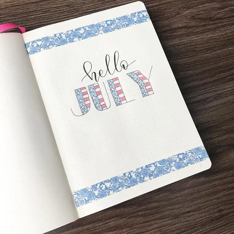 July Bullet Journal Cover Page Ideas 11 Simple and patriotic July bullet journal cover with 'July' designed like the American flag.