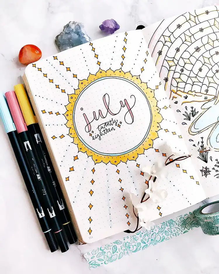 July Bullet Journal Cover Page Ideas 14 Geometric sun and diamond shapes on a fun July bullet journal cover.