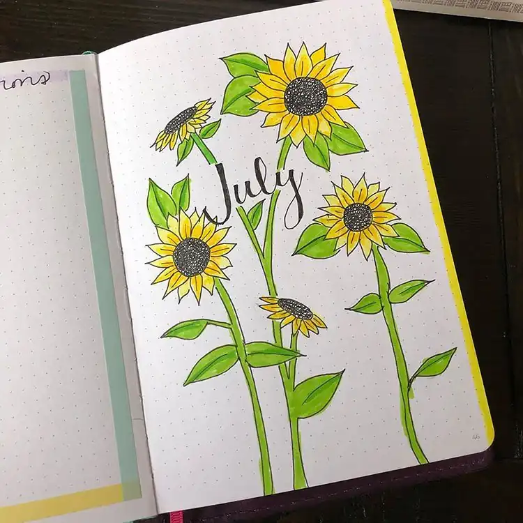 July Bullet Journal Cover Page Ideas 17 Sunflowers with stalks on a beautiful July bullet journal cover page.