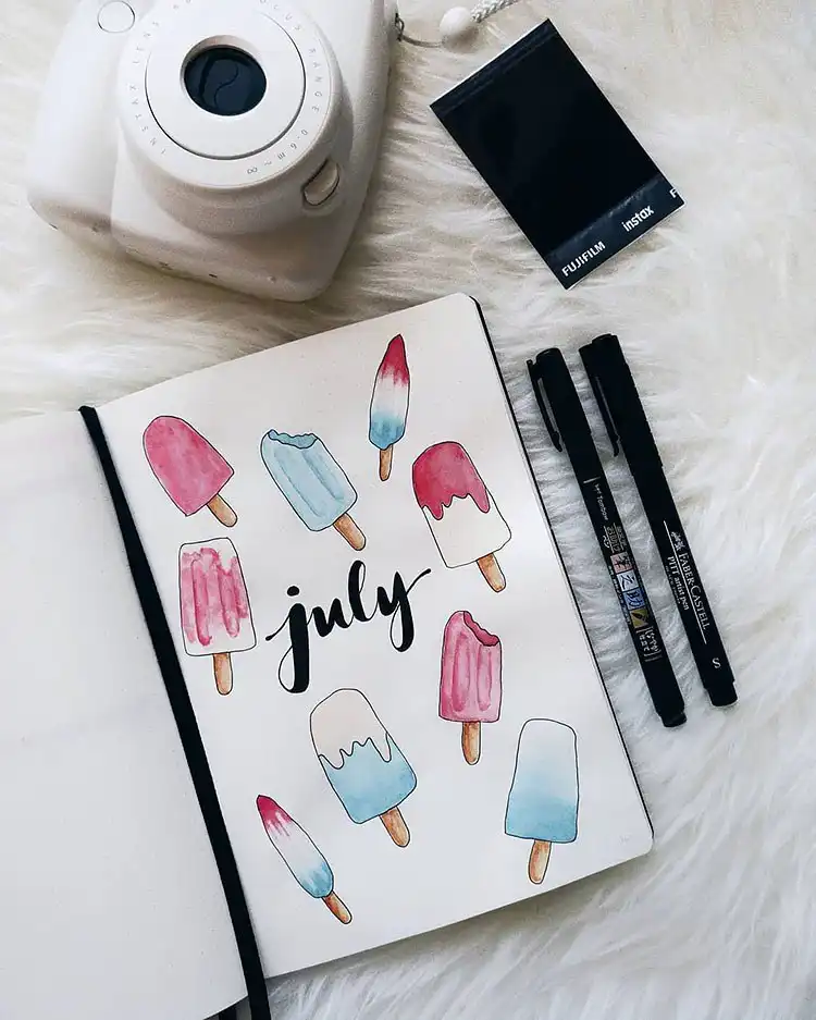 July Bullet Journal Cover Page Ideas 25 Creative 'July' spelled out with colorful popsicle designs on a journal cover.