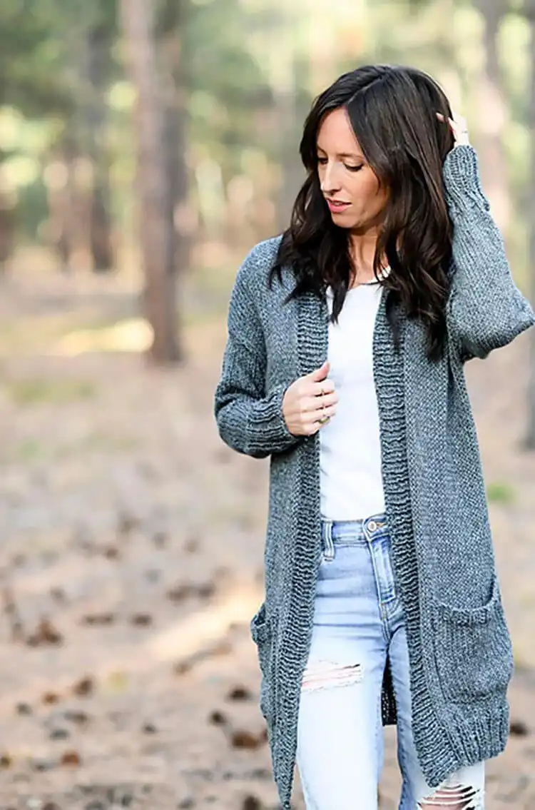 Display of a finished, easy-to-knit cardigan, demonstrating basic stitches perfect for new knitters.