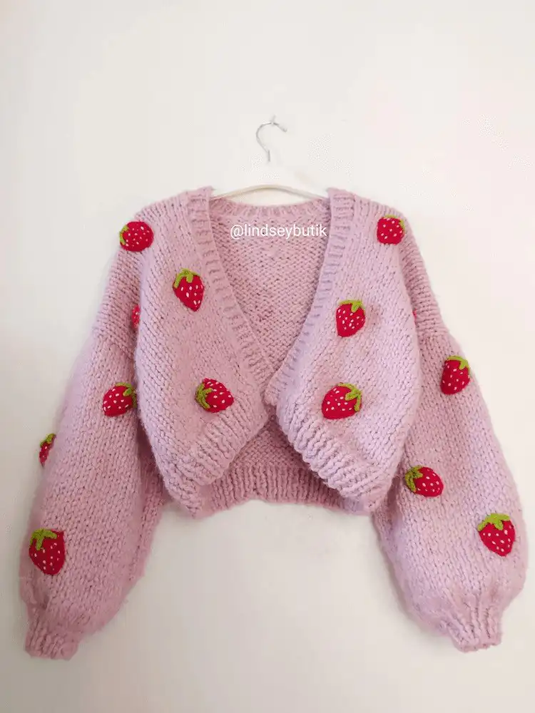 Whimsical Strawberry Cardigan, a statement piece that gathers compliments with its unique design.
