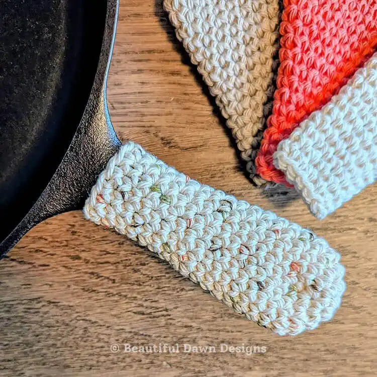 A practical green crochet cast iron skillet handle cover, designed for heat protection and easy handling.
