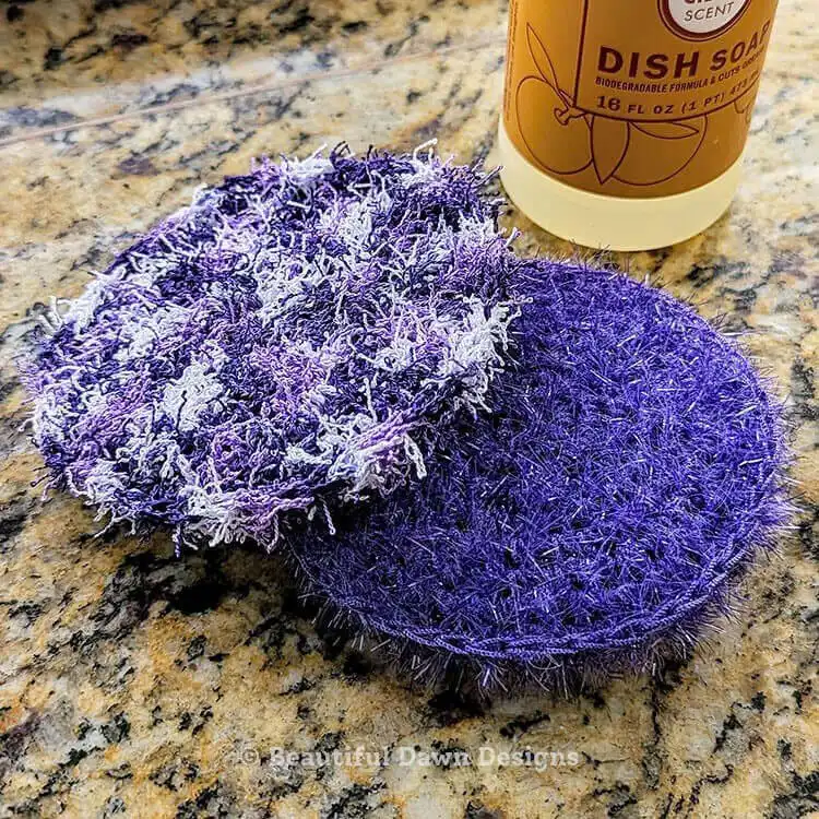 A textured green easy crochet dish scrubby pad, designed for effective and quick dish cleaning.