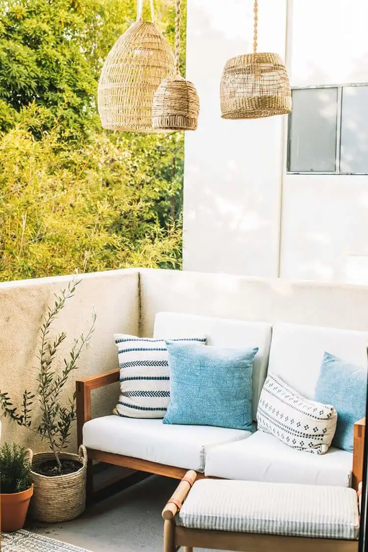 Make Your Own Lantern with These DIY Ideas 4 Stylish DIY Wireless Basket Lanterns illuminating an outdoor patio space, made from repurposed wicker baskets.
