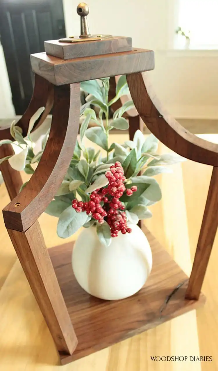 Make Your Own Lantern with These DIY Ideas 7 Unique DIY Wooden Lantern with a distinct curved top, crafted from scrap wood for a personalized home accent.