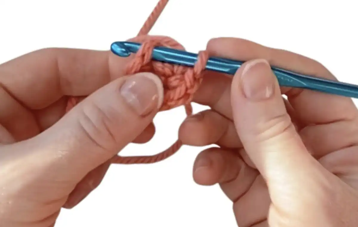 Step 9: Continuing stitches and pulling tail to close the magic circle.