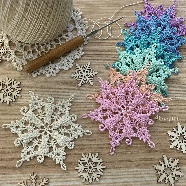 A close-up of the 'Frosty Tails Snowflake' crochet pattern, revealing its unique cat-shaped details within the snowflake design.