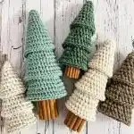 Festive candy cane striped crochet Christmas tree in red and white, evoking classic holiday cheer.