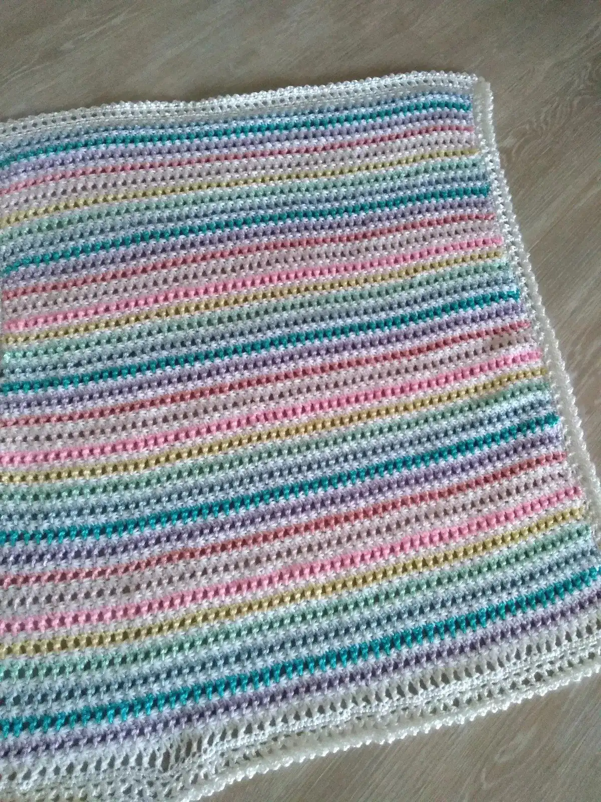 Cozy Bumpy Rows Baby Blanket in a warm neutral color, featuring thick texture for ultimate winter comfort.