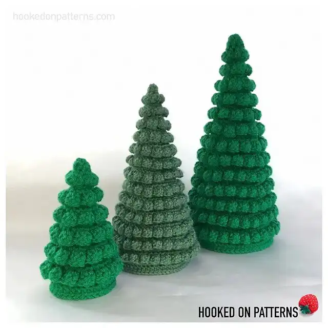 Flat green crochet Christmas tree ornament with a simple shape, ideal for hanging.