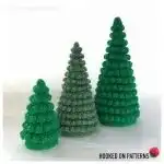 Crochet Christmas tree in icy blue and white tones, featuring textured stitches for a winter wonderland effect.
