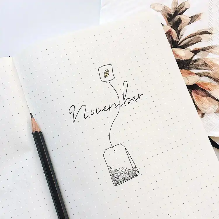 Simplistic tea bag drawing for a minimalist November bullet journal cover, featuring elegant hand-lettering for the month