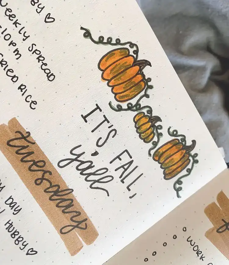 Simple quote 'It’s Fall Y’all' on a calendar page, designed with cheerful autumn lettering