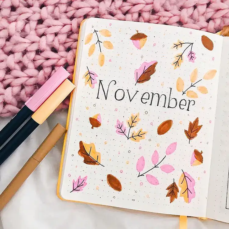 Soft and simple November cover page design featuring delicate leaves and acorns in muted tones