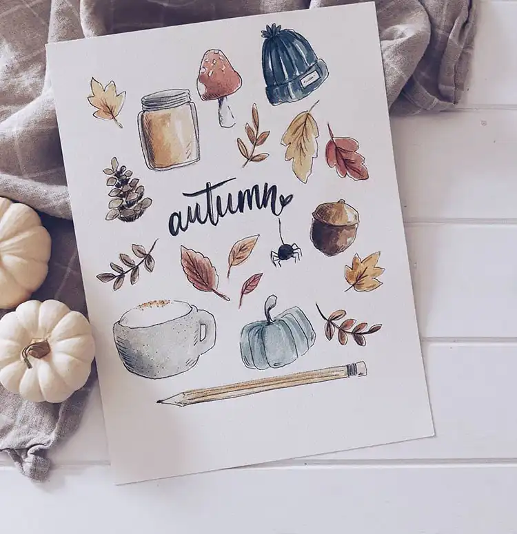 October bullet journal design featuring a vintage record player with pumpkins and floating leaves in the background.