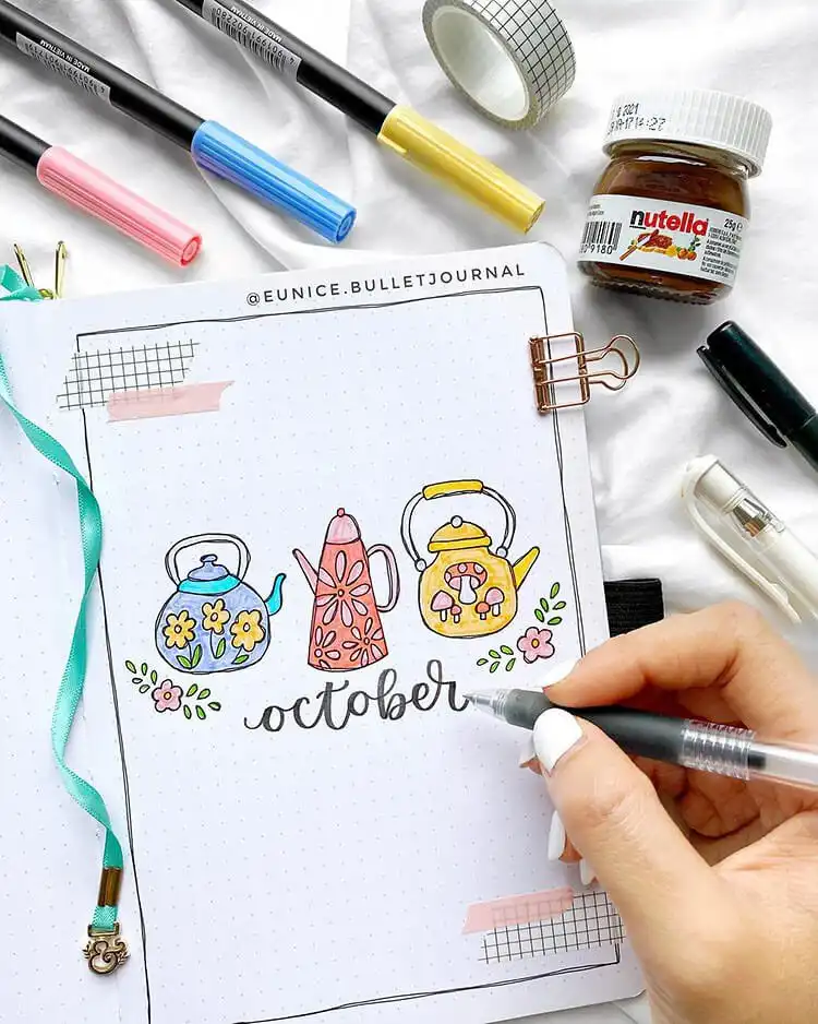 Bullet journal spread concept for autumn coziness, with warm elements and subtle details like a spider.