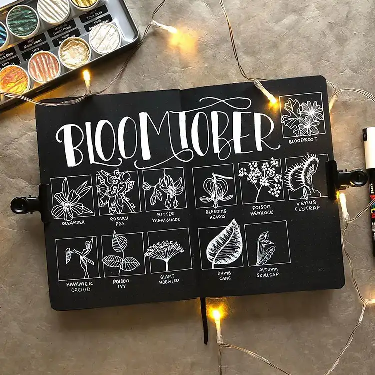Cute autumnal bullet journal spread with whimsical teapots, delicate flowers, and charming mushrooms.