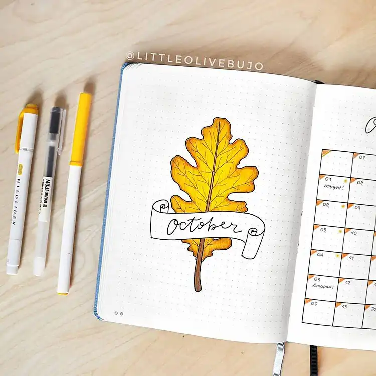 October bullet journal calendar adorned with colorful fall leaves, providing perfect autumn vibes.
