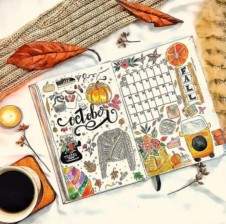 Simple October bullet journal cover page featuring a single golden leaf representing the fall season.