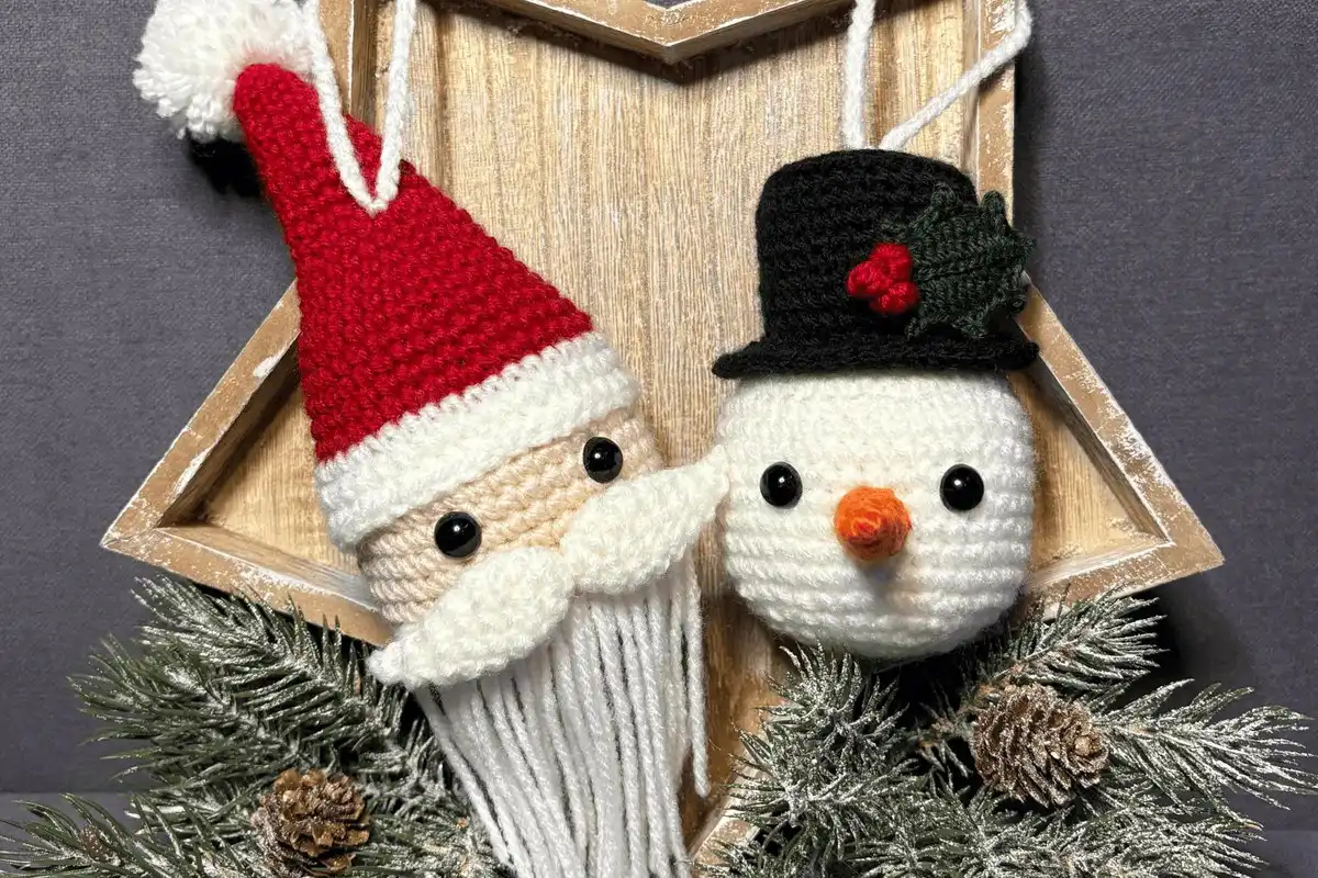 Personalized Christmas Baubles – Custom & Free Crochet Ornament Patterns 7 Colorful crocheted mouse ears ornaments, decorated with festive themes like Santa, reindeer antlers, and peppermint swirls, perfect for a whimsical tree.