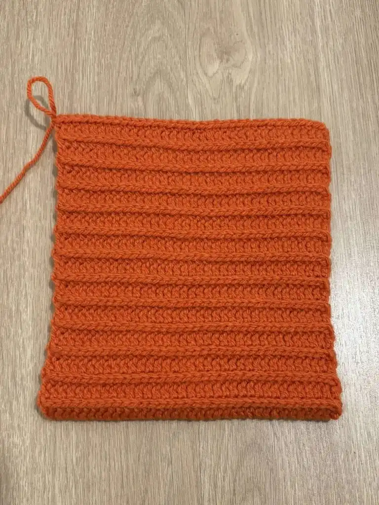 The bottom of the pumpkin pulled tightly and secured, showing the closed base after cinching.