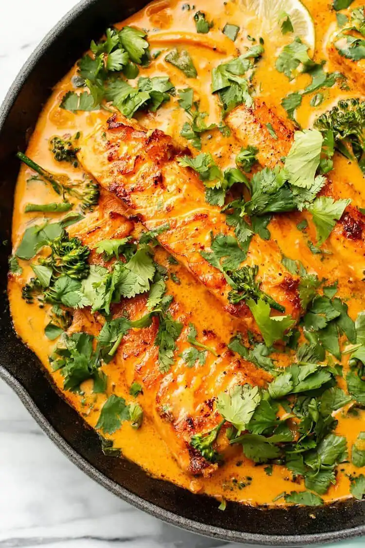 Baked Honey Garlic Salmon in Foil, opened to show the perfectly cooked, glazed salmon fillet.