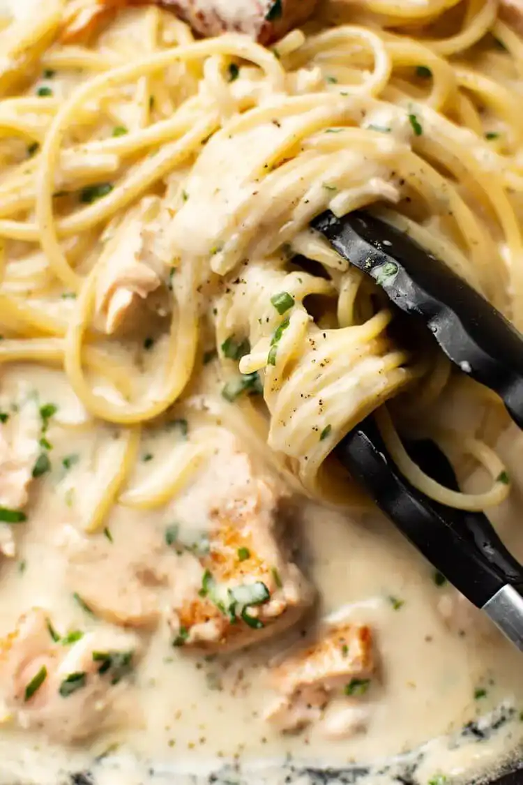 Garlic Shrimp Mac and Cheese, bubbling hot in a casserole dish with a golden-brown parmesan topping.
