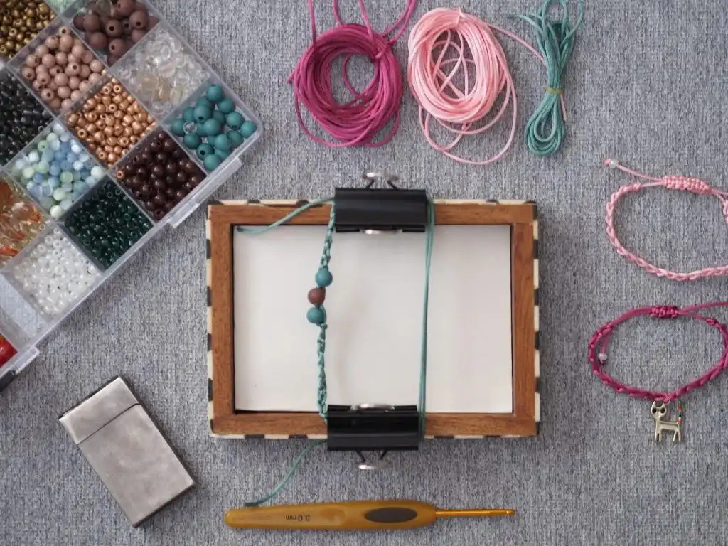 Close-up of an adjustable square knot closure on a crocheted bracelet, illustrating the technique crucial for a perfect fit.