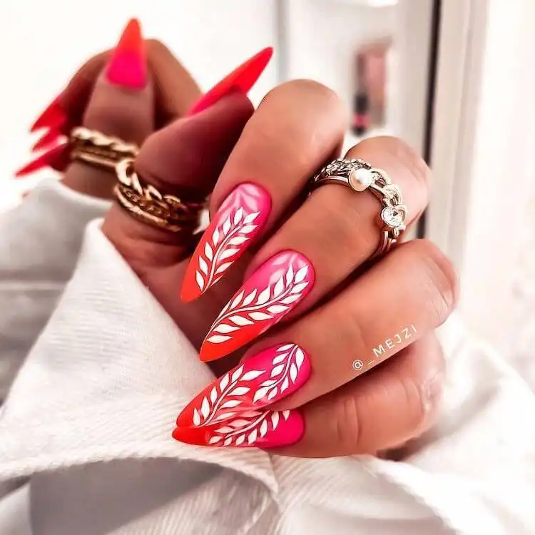 Stunning red acrylic nails in coffin and stiletto shapes, featuring various designs like glitter, rhinestones, and gradients to spice up your look.