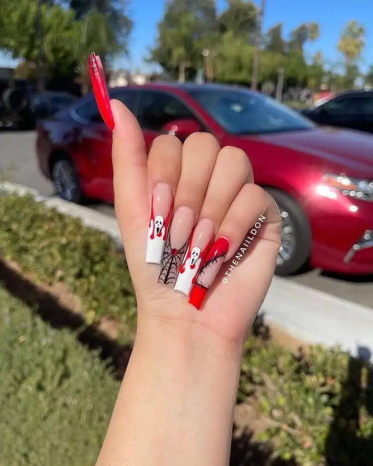 Classic red almond-shaped acrylic nails, embodying ultimate feminine vibe and timeless style.