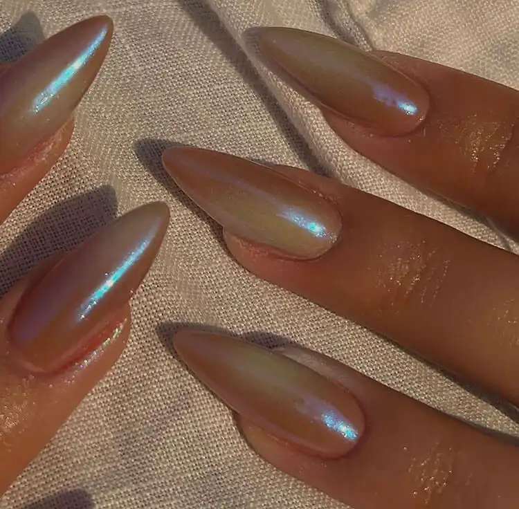 Stunning Blue Nail Designs - Perfect Winter Nail Design Ideas 1 Sparkling Iridescent Nails featuring multi-dimensional shimmer for a perfect winter look, embodying stunning blue nail designs.