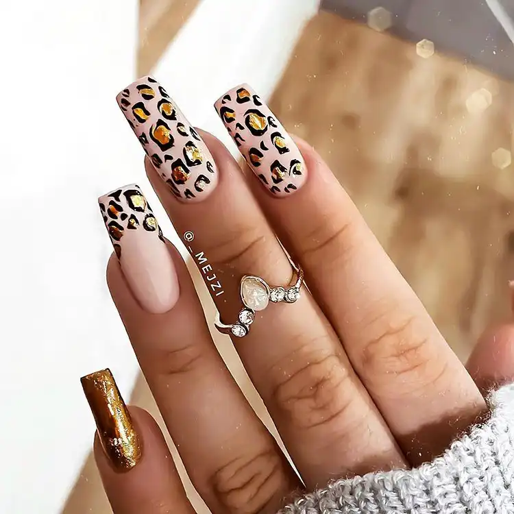 Stunning Blue Nail Designs - Perfect Winter Nail Design Ideas 20 Stylish Gold Leopard Print nails, offering a festive yet versatile look for stunning blue nail designs and winter trends.