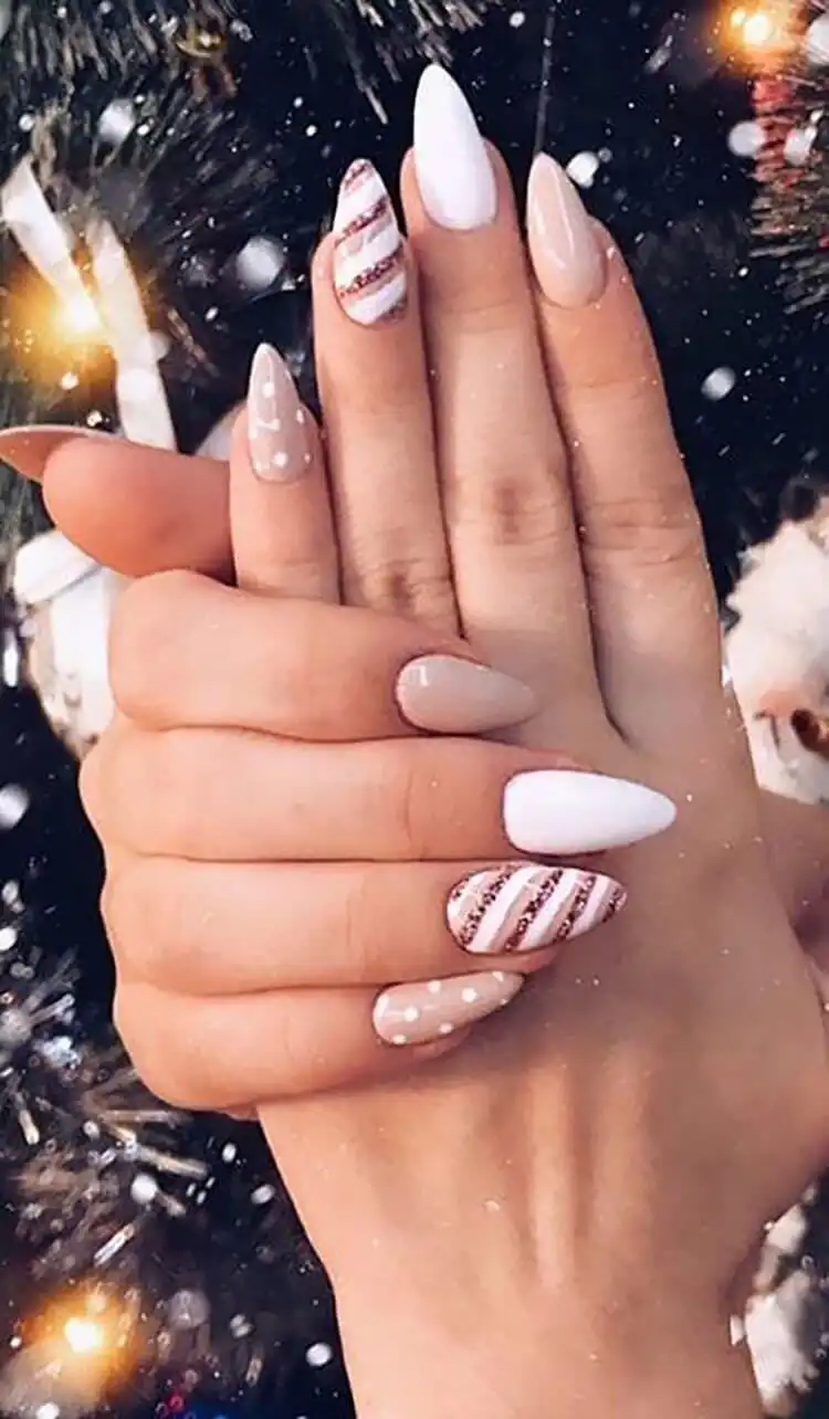 Stunning Blue Nail Designs - Perfect Winter Nail Design Ideas 21 Versatile Polka Dots and Stripes stiletto nails, allowing creative color combinations like candy cane or snowflakes for stunning blue nail designs.