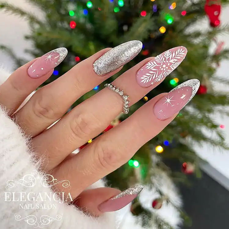 Stunning Blue Nail Designs - Perfect Winter Nail Design Ideas 22 Sparkling Silver and White Nails, creating a glittery snowflake effect perfect for winter, a stunning blue nail designs inspiration.