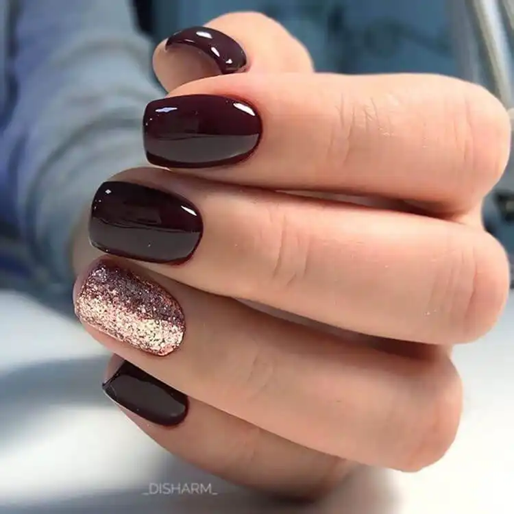 Stunning Blue Nail Designs - Perfect Winter Nail Design Ideas 23 Glitter Nail on Ring Finger with solid colored nails, an elegant and festive design for winter and New Year's celebrations, in stunning blue nail designs.