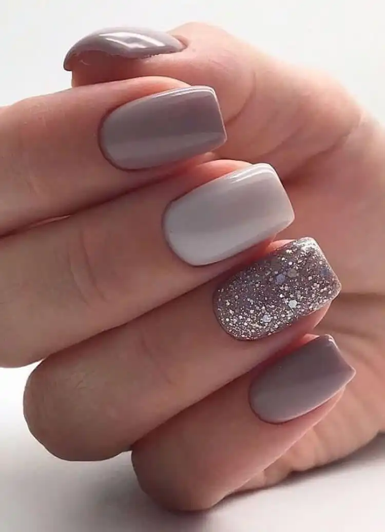 Stunning Blue Nail Designs - Perfect Winter Nail Design Ideas 24 Sophisticated Grey and Glitter nails, perfect for New Year's celebrations with a fun accent, complementing stunning blue nail designs.