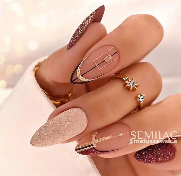 Stunning Blue Nail Designs - Perfect Winter Nail Design Ideas 5 Beautiful Geometric Shapes nail art combining intricate patterns with glitter and matte polish, showcasing unique winter nail design ideas.