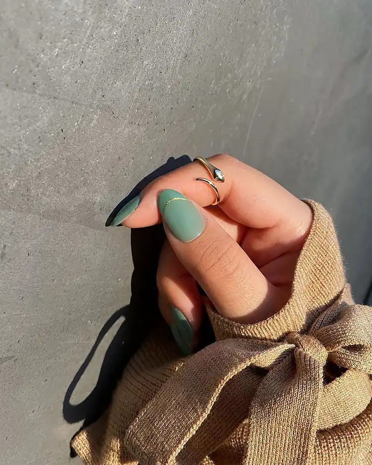 Stunning Blue Nail Designs - Perfect Winter Nail Design Ideas 10 Elegant Seafoam Green and Gold nails featuring delicate glitter lines, a gorgeous and refined winter nail design idea.