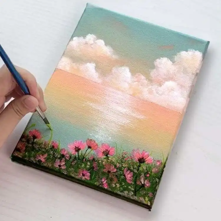 Pastel Flowers by the Sea acrylic painting with pink blooms and soft blue ocean waves, a dreamy canvas art idea.