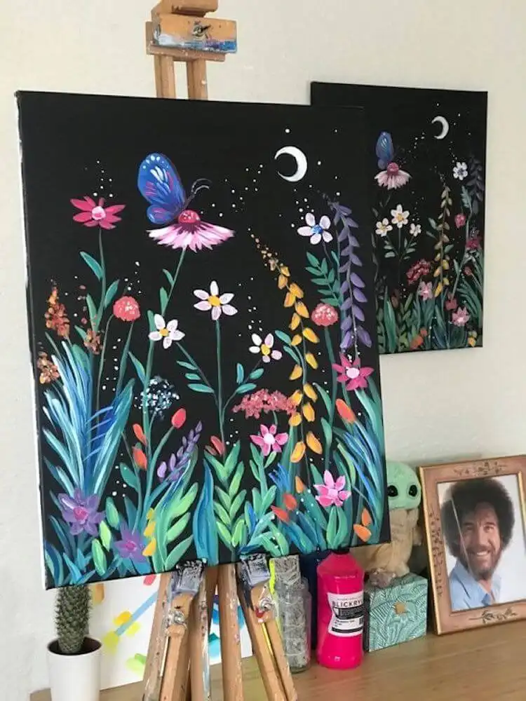 Midnight Butterfly Garden acrylic painting on a black canvas, vibrant butterflies and flowers in glowing colors.
