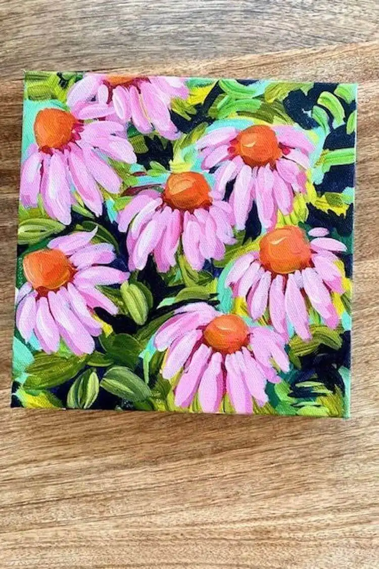 Step-by-step tutorial image of how to paint coneflowers with vibrant pink and orange acrylics on canvas.
