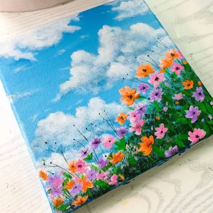 A wide, colorful flower field acrylic painting, showcasing a vibrant array of blossoms.